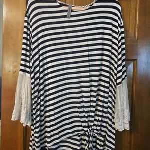 Super soft boutique top with beautiful soft lace bell sleeve and front tie